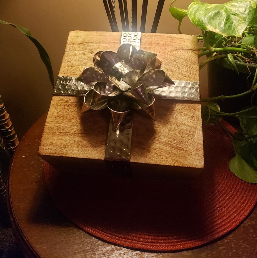 Hand made wooden box with stamped metal bow.